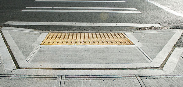 An ADA compliant curb ramp.
