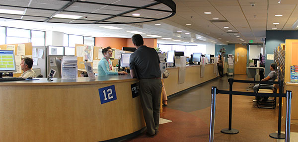 Customer being helped in the Applicant Services Center