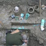A man working on a private sewer system.
